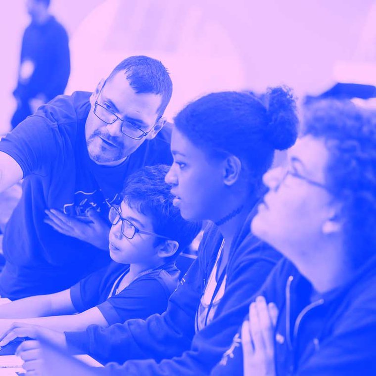 A session taking place at MozFest where a facilitator is supporting a group of young people