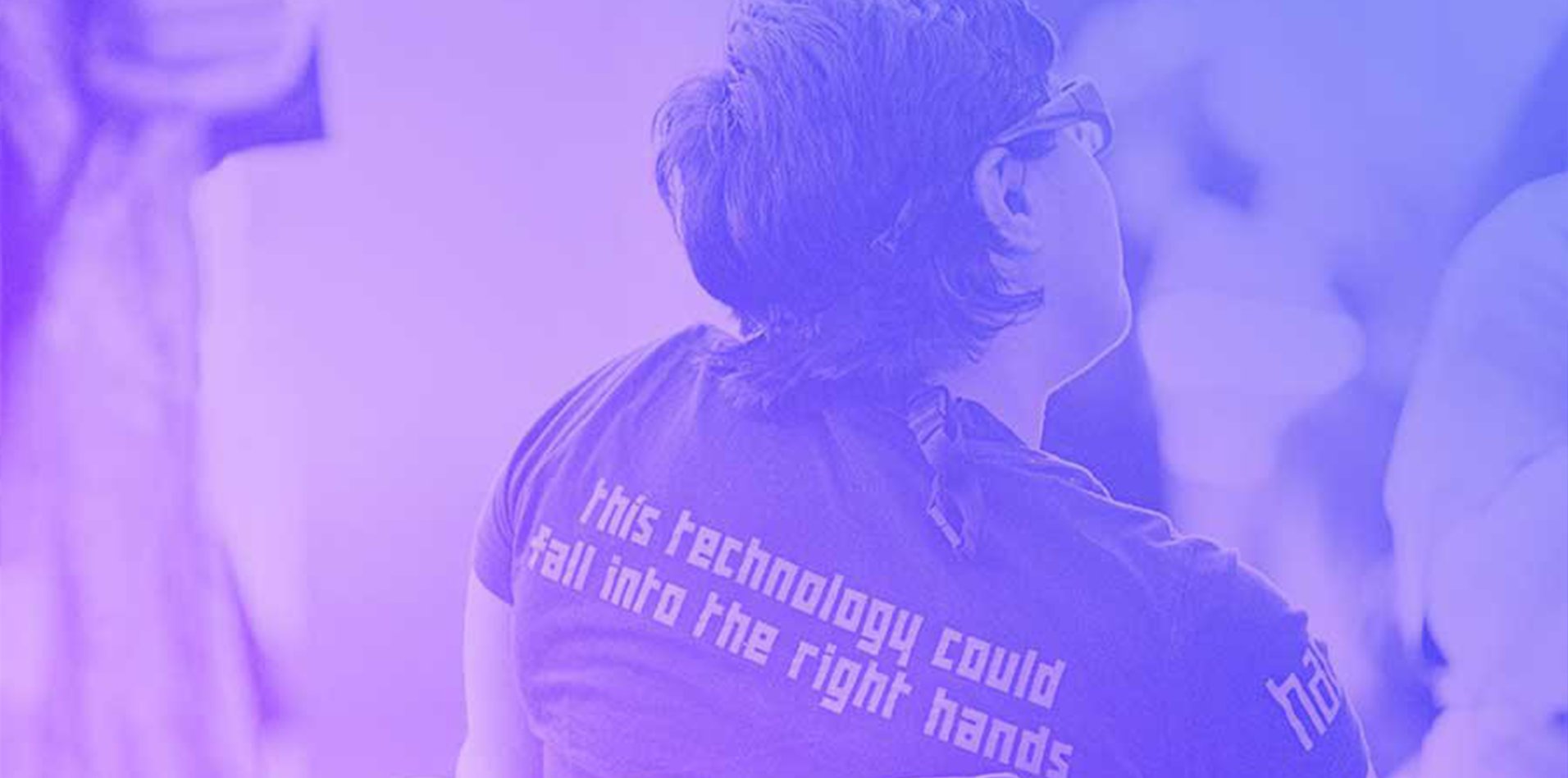 Person wearing a tshirt that says "this technology could fall into the right hands"